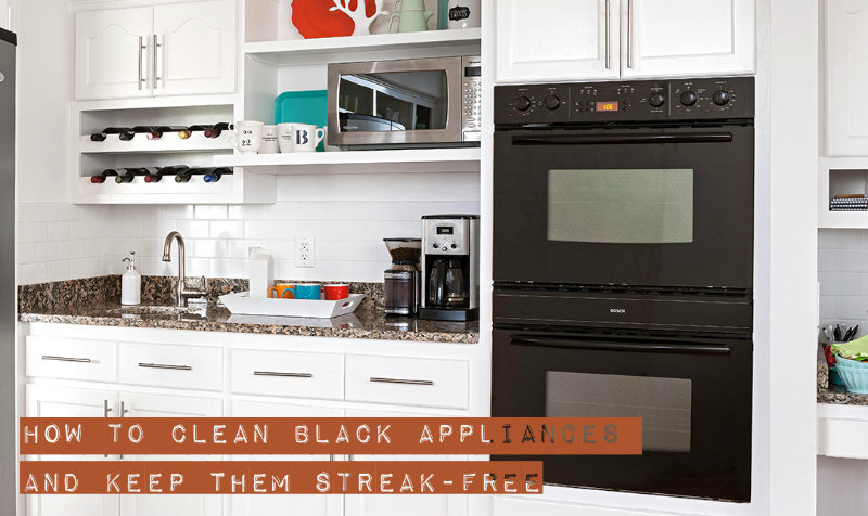 beautifully decorated kitchen with black appliances