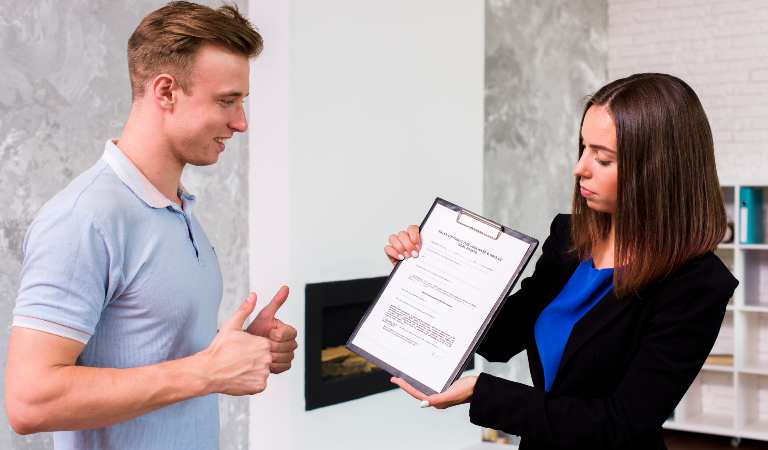 Man is showing thumps up to a lady lawyer.