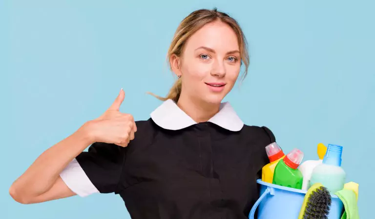 woman with some cleaning products posing for a picture