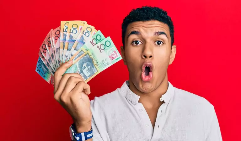 young man with some australian curruncy in hand