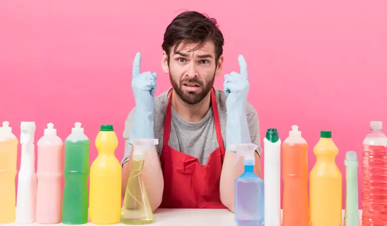 young man with some chemically loaded cleaning products
