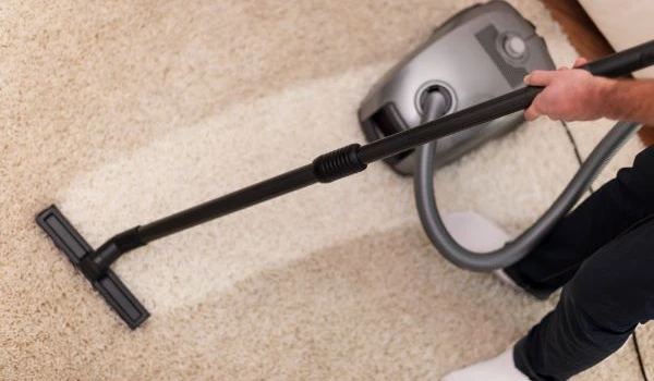 Close up of vacuuming a carpet