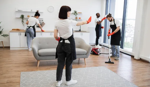 Professional housekeeper services company team working at customer house