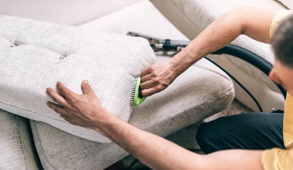 Process of deep furniture cleaning, removing dirt from sofa. Washing concept